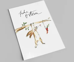Postkarte zu Ostern | Hängender Hase mit seiner Karotte | Frohe Ostern
